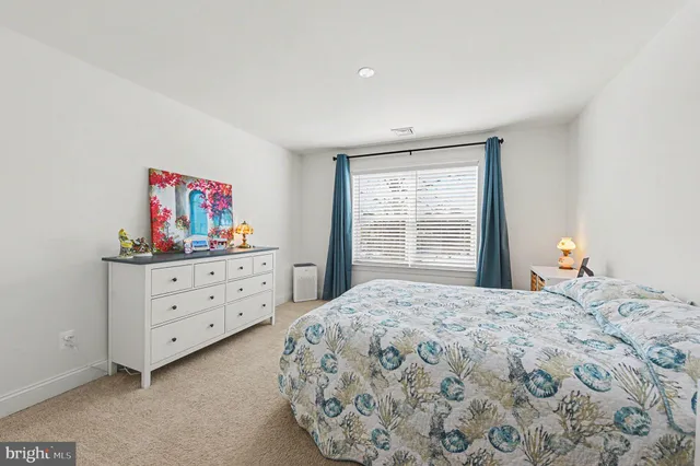 a spacious bathroom with a bathtub sink and toilet
