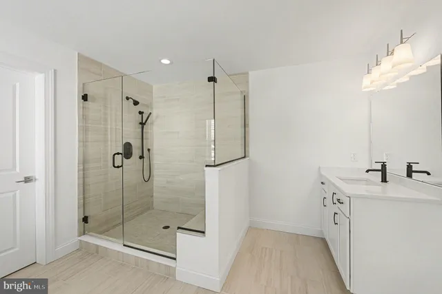 a bathroom with a sink and shower