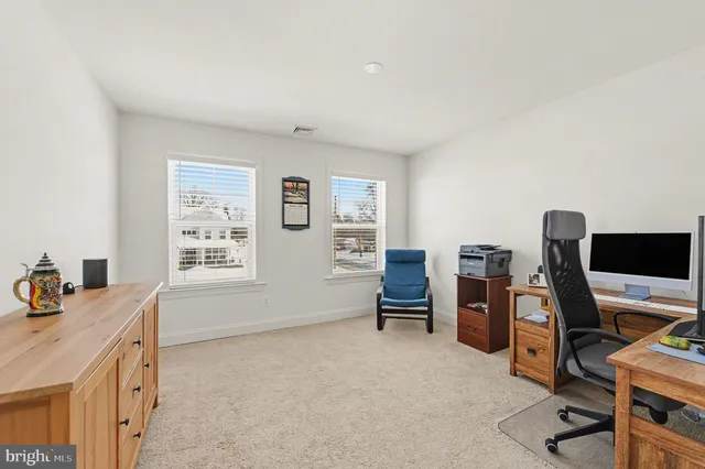 a bathroom with a sink vanity and mirror