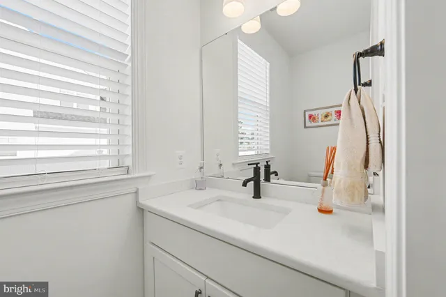 a bedroom with a bed dresser and a window