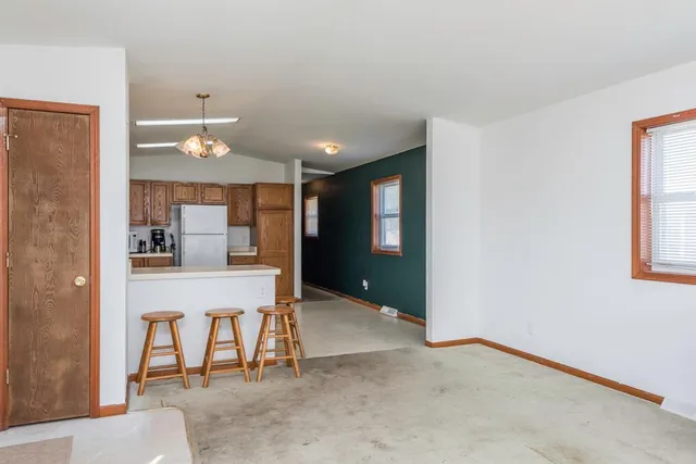 a view of kitchen with furniture and window