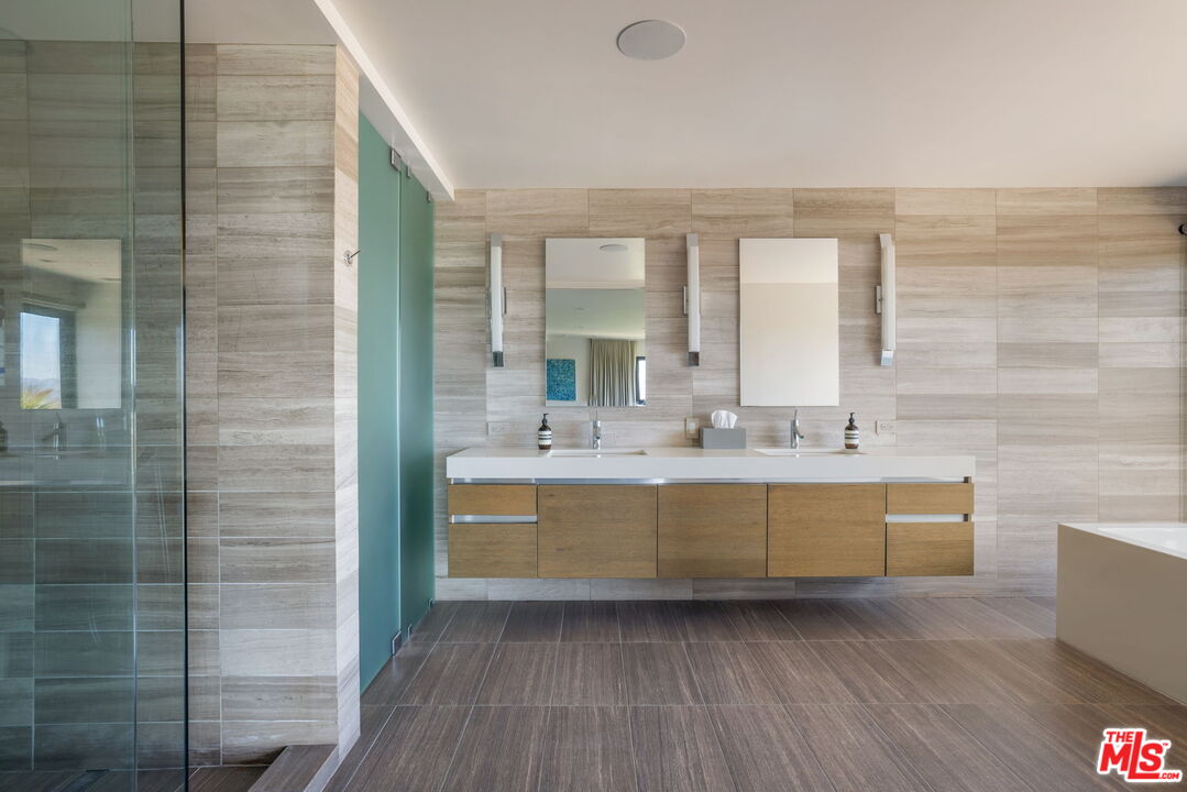 3337 Beverly Ranch Road Beverly Hills, CA 90210 - Photo 21 of 36 a view of bathroom with bathtub and shower