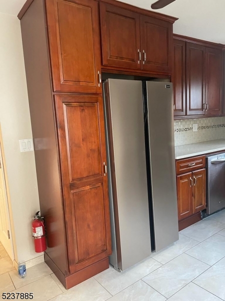 28 Boyd Street, Unit 2 Lodi, NJ 07644 - Photo 2 of 9 a kitchen with a refrigerator and cabinets