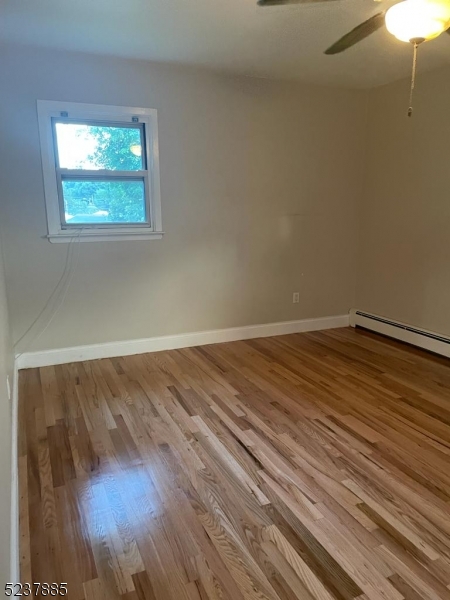 28 Boyd Street, Unit 2 Lodi, NJ 07644 - Photo 6 of 9 a view of a room with wooden floor and window