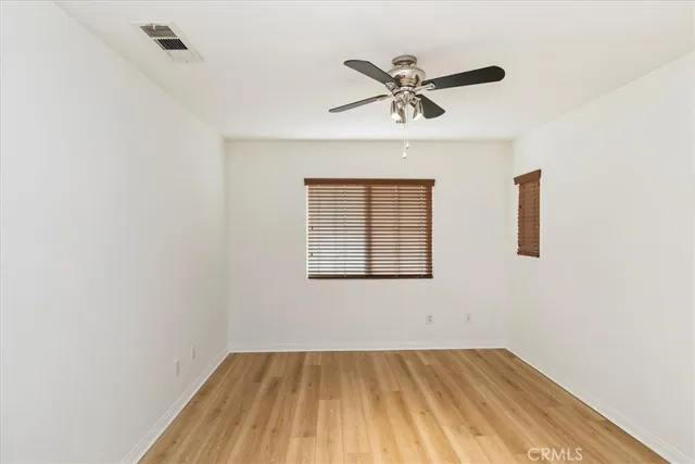 a bathroom with a double vanity sink a mirror and a shower