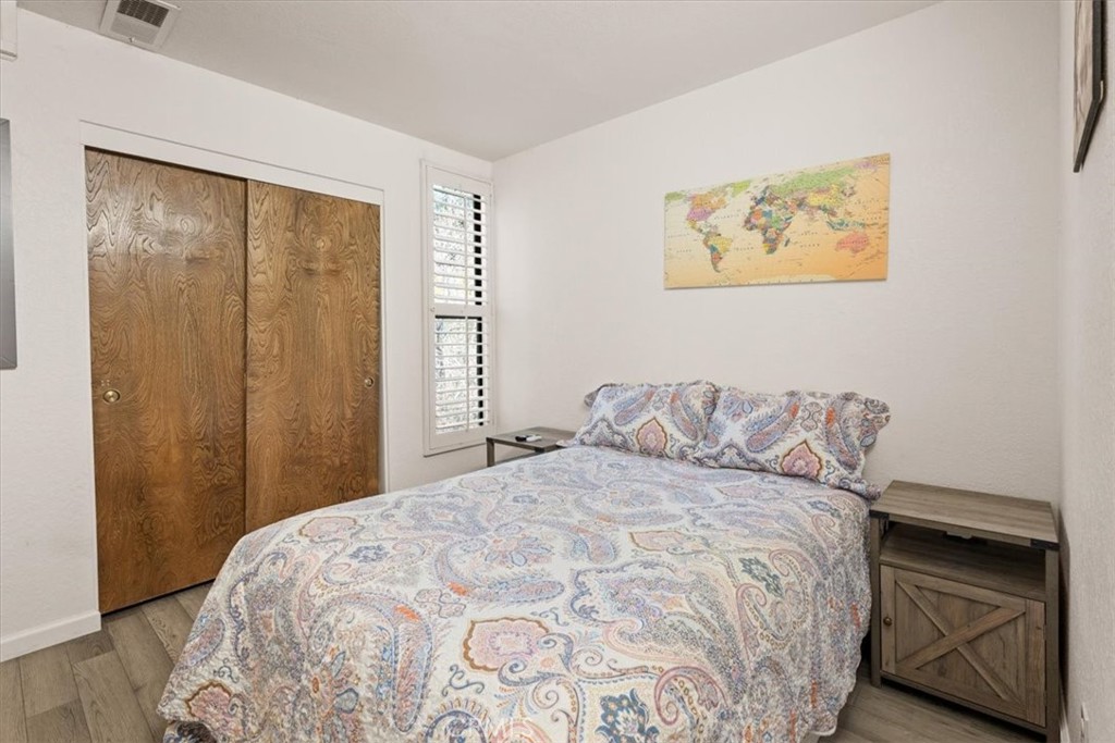 760 Bluejay Road, Unit 26 Big Bear Lake, CA 92315 - Photo 13 of 35 a bedroom with a bed and a window