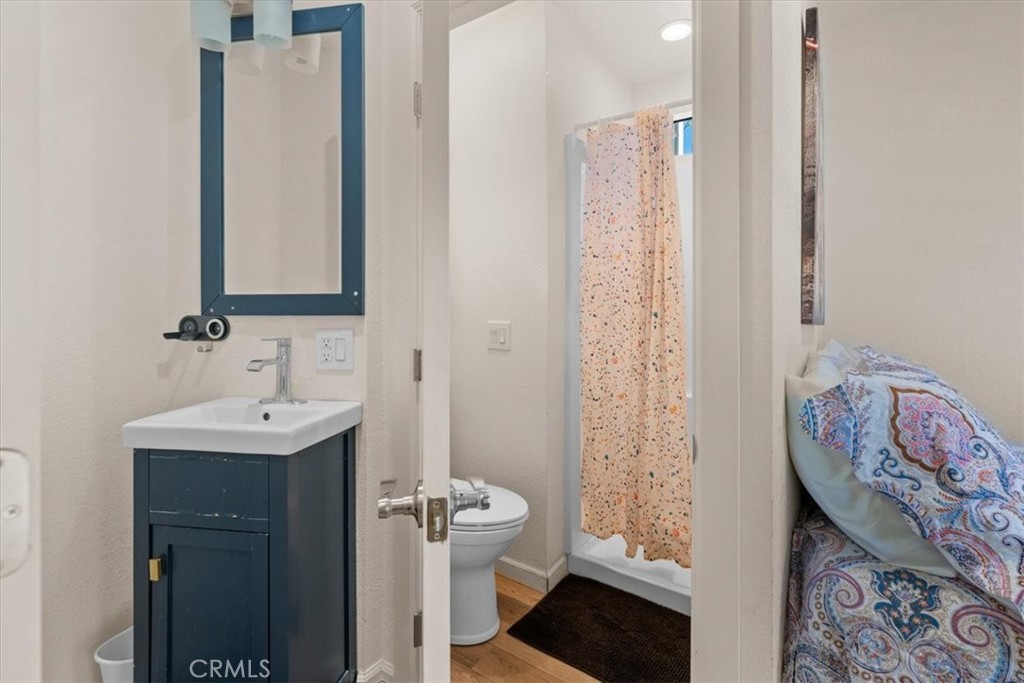 760 Bluejay Road, Unit 26 Big Bear Lake, CA 92315 - Photo 20 of 35 a bathroom with a sink a toilet and shower