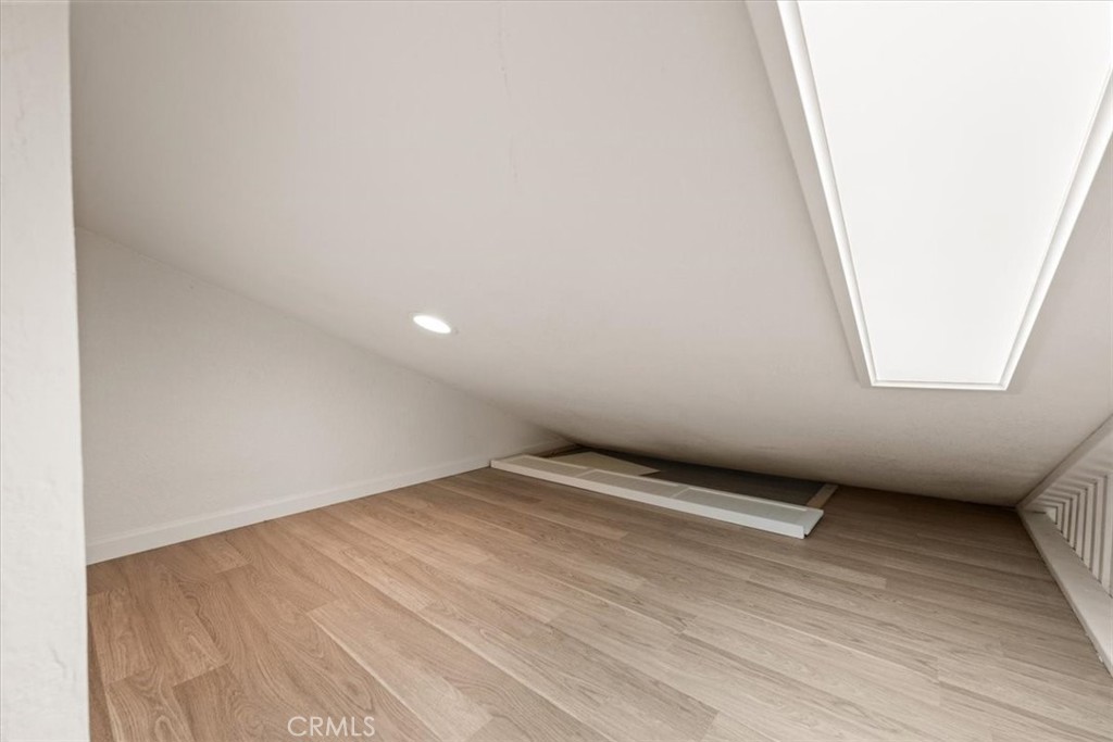 760 Bluejay Road, Unit 26 Big Bear Lake, CA 92315 - Photo 21 of 35 a view of an empty room and wooden floor