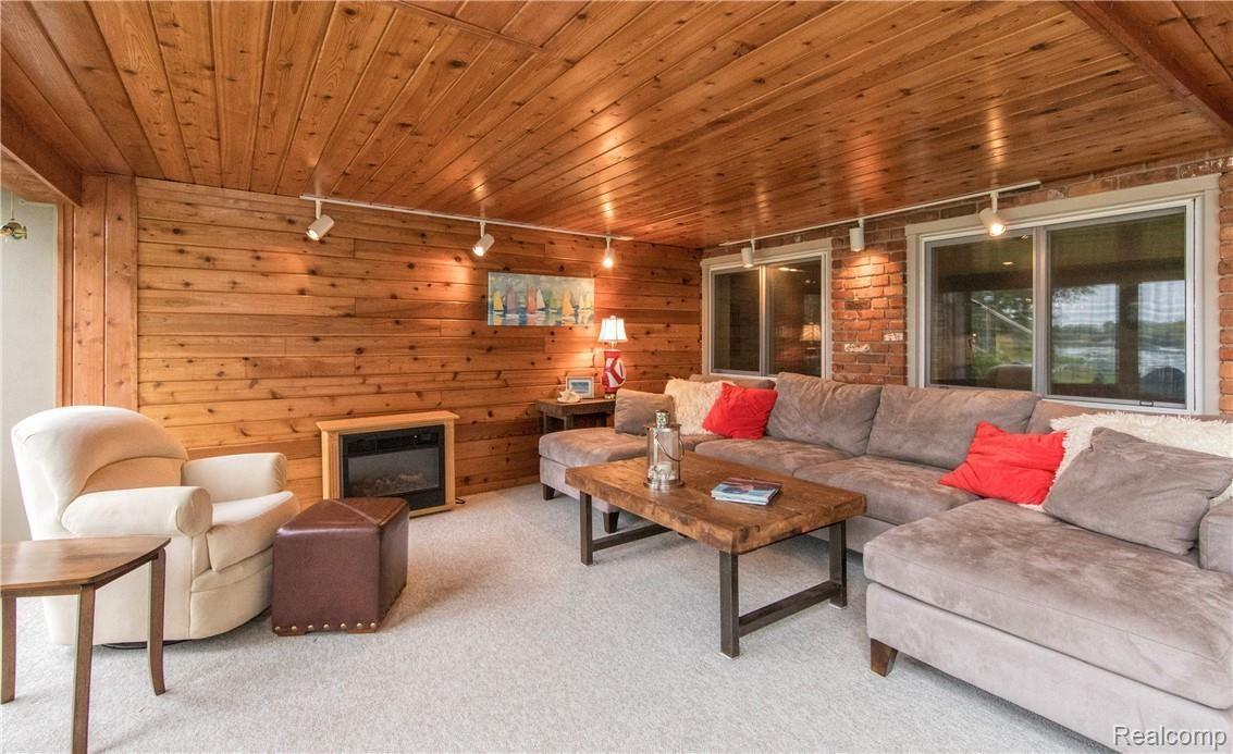 7272 Hatchery Road Waterford, MI 48327 - Photo 33 of 46 Atrium seating area with fireplace!