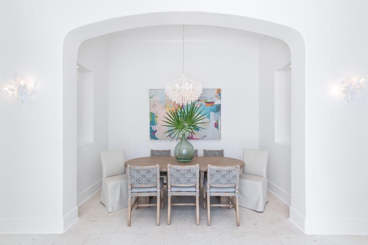 165 North Charles Street Inlet Beach, FL 32461 - Photo 5 of 38 a dining room with furniture and a potted plant