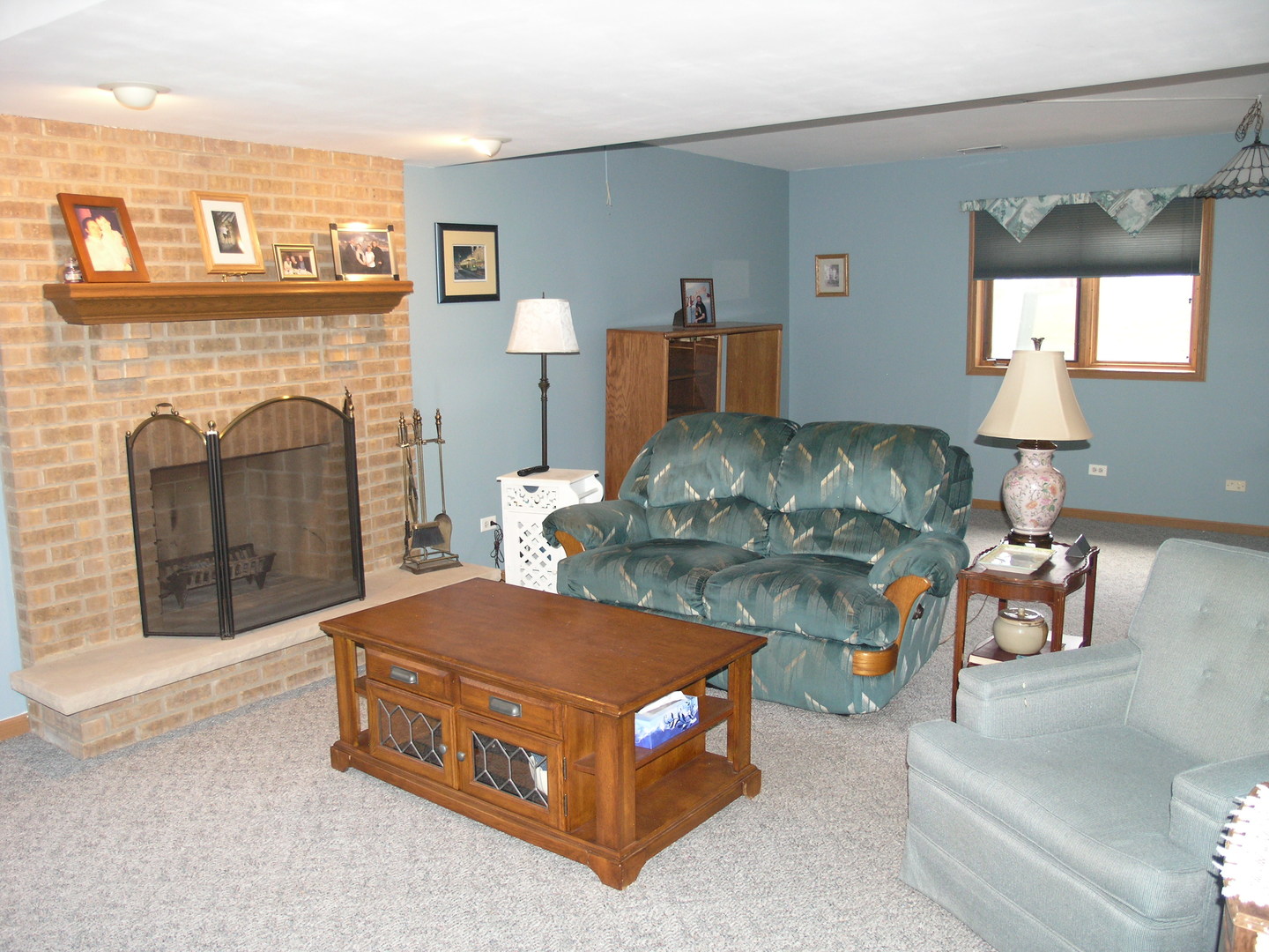 304 Georgetown Avenue Romeoville, IL 60446 - Photo 13 of 17 a living room with furniture and a fireplace