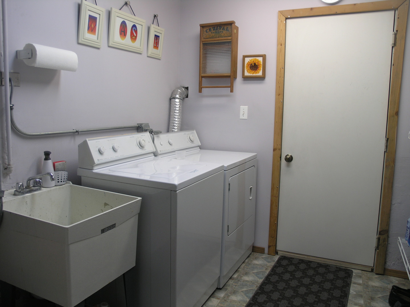 304 Georgetown Avenue Romeoville, IL 60446 - Photo 14 of 17 a bathroom with a sink and a mirror