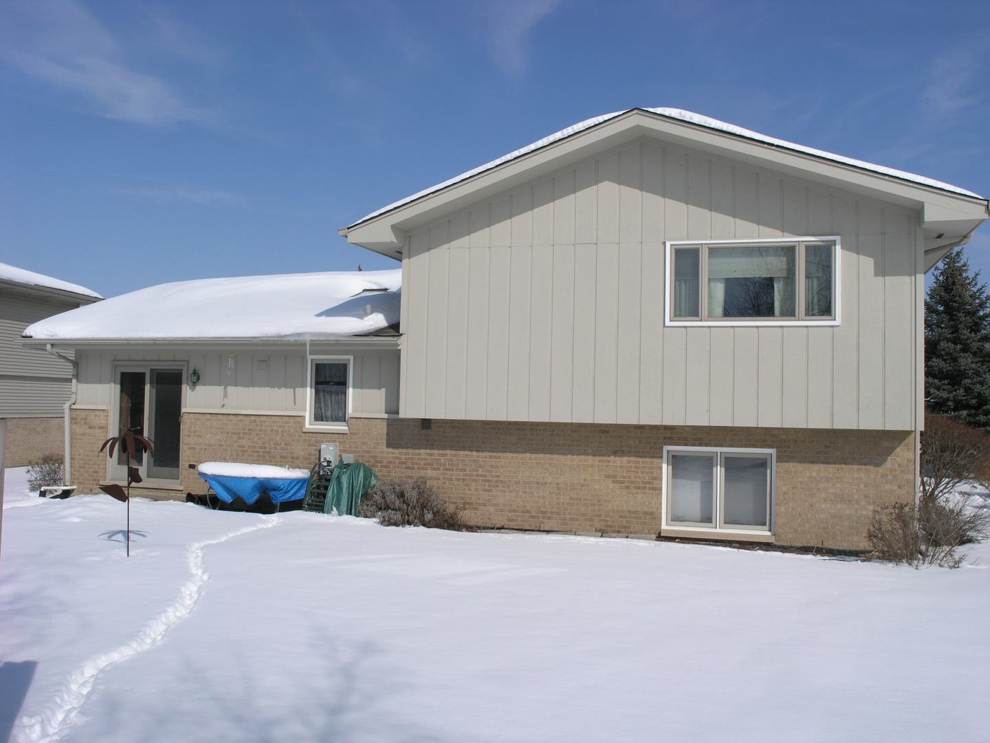 304 Georgetown Avenue Romeoville, IL 60446 - Photo 17 of 17 a front view of a house with a yard