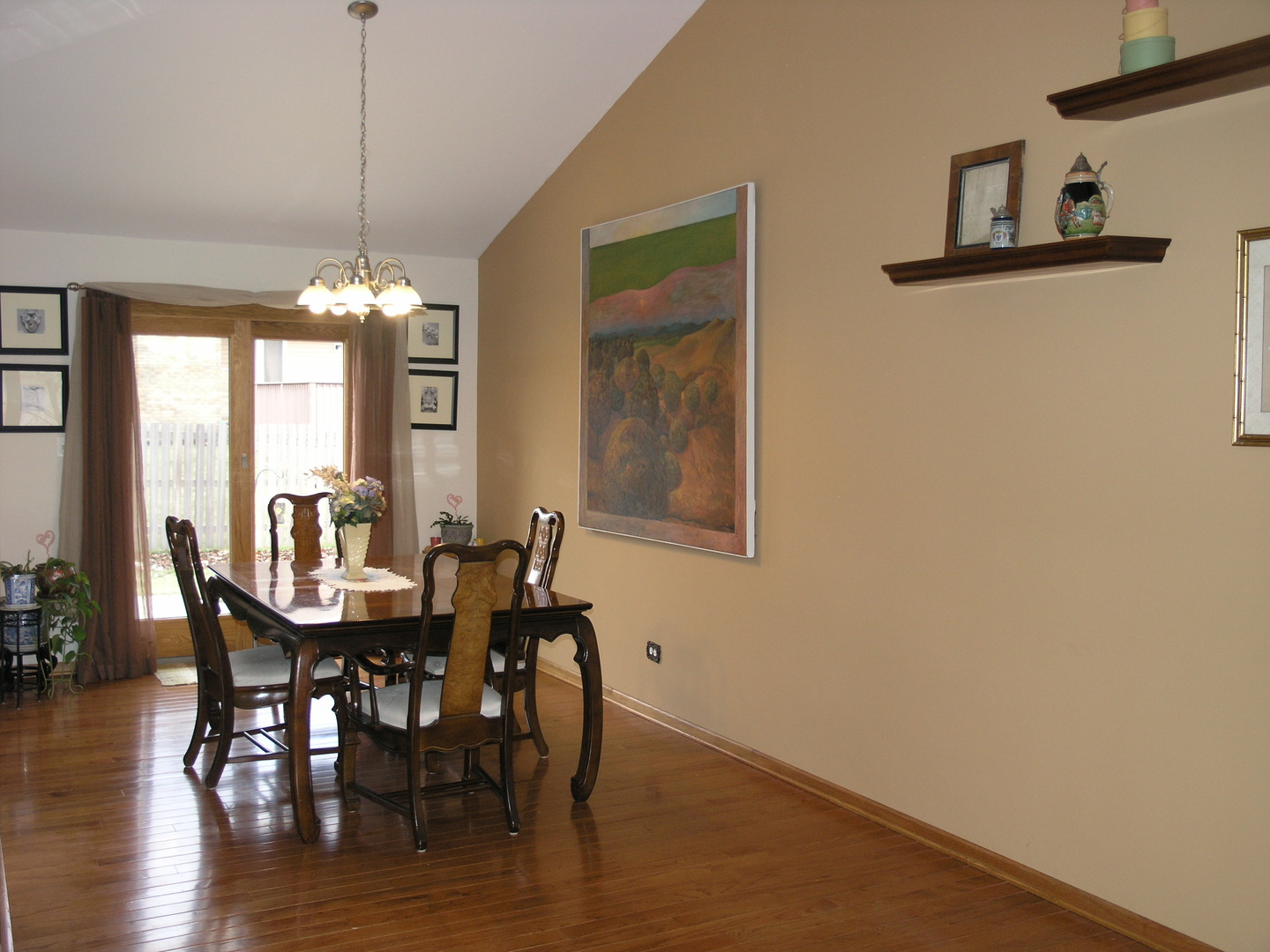 304 Georgetown Avenue Romeoville, IL 60446 - Photo 4 of 17 a view of a dining room with furniture window and wooden floor