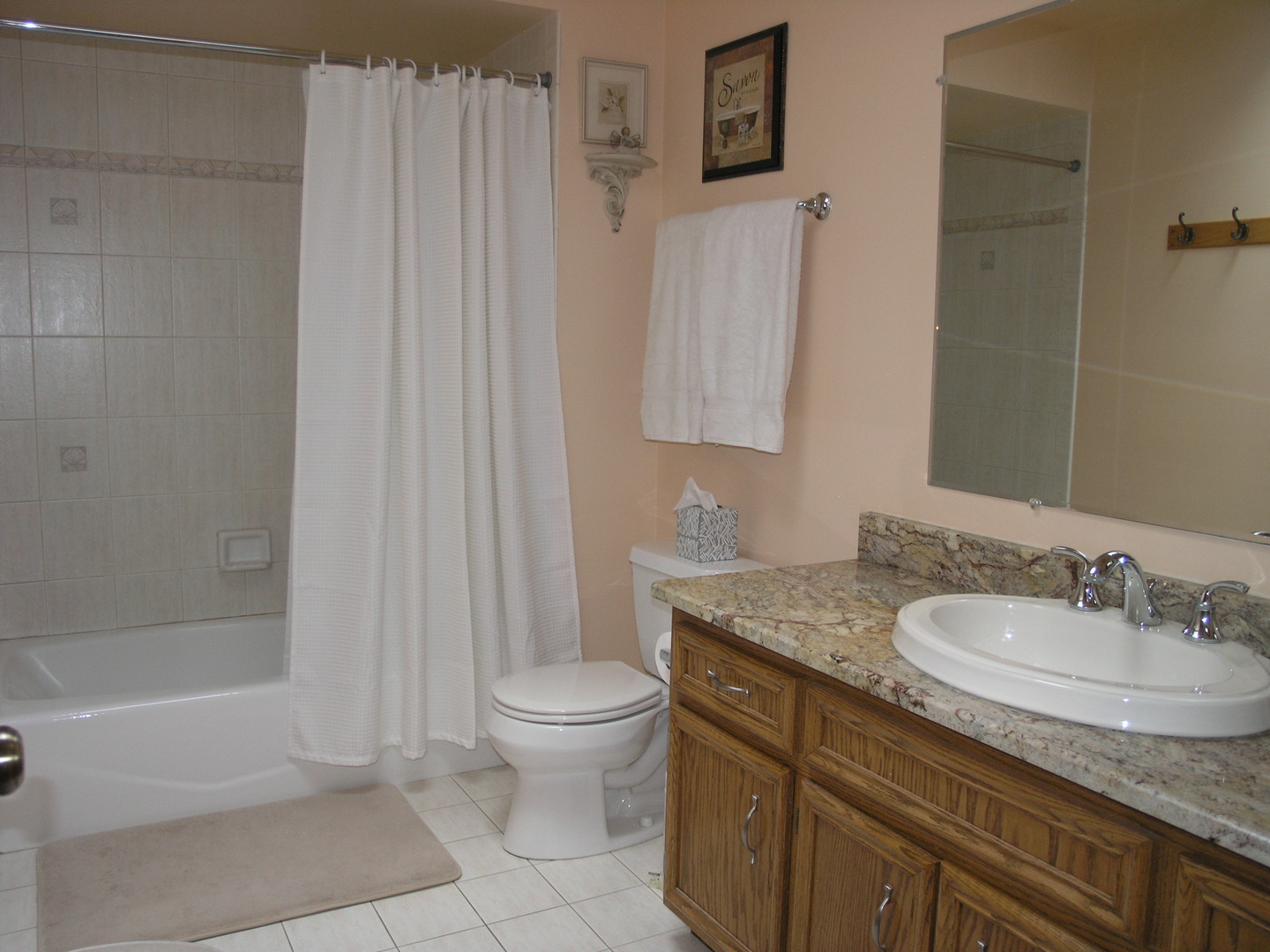 304 Georgetown Avenue Romeoville, IL 60446 - Photo 6 of 17 a bathroom with a granite countertop sink a toilet and bathtub