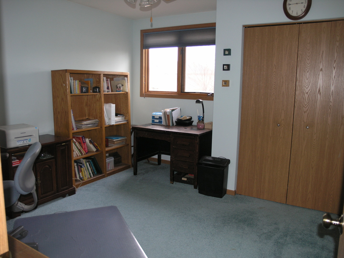 304 Georgetown Avenue Romeoville, IL 60446 - Photo 9 of 17 a view of a workspace with furniture and a window