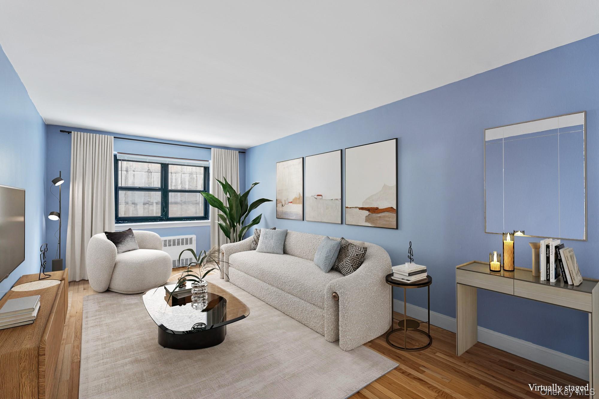 102-55 67th Road, Unit 2V Queens, NY 11375 - Photo 4 of 14 a living room with furniture and a potted plant on table