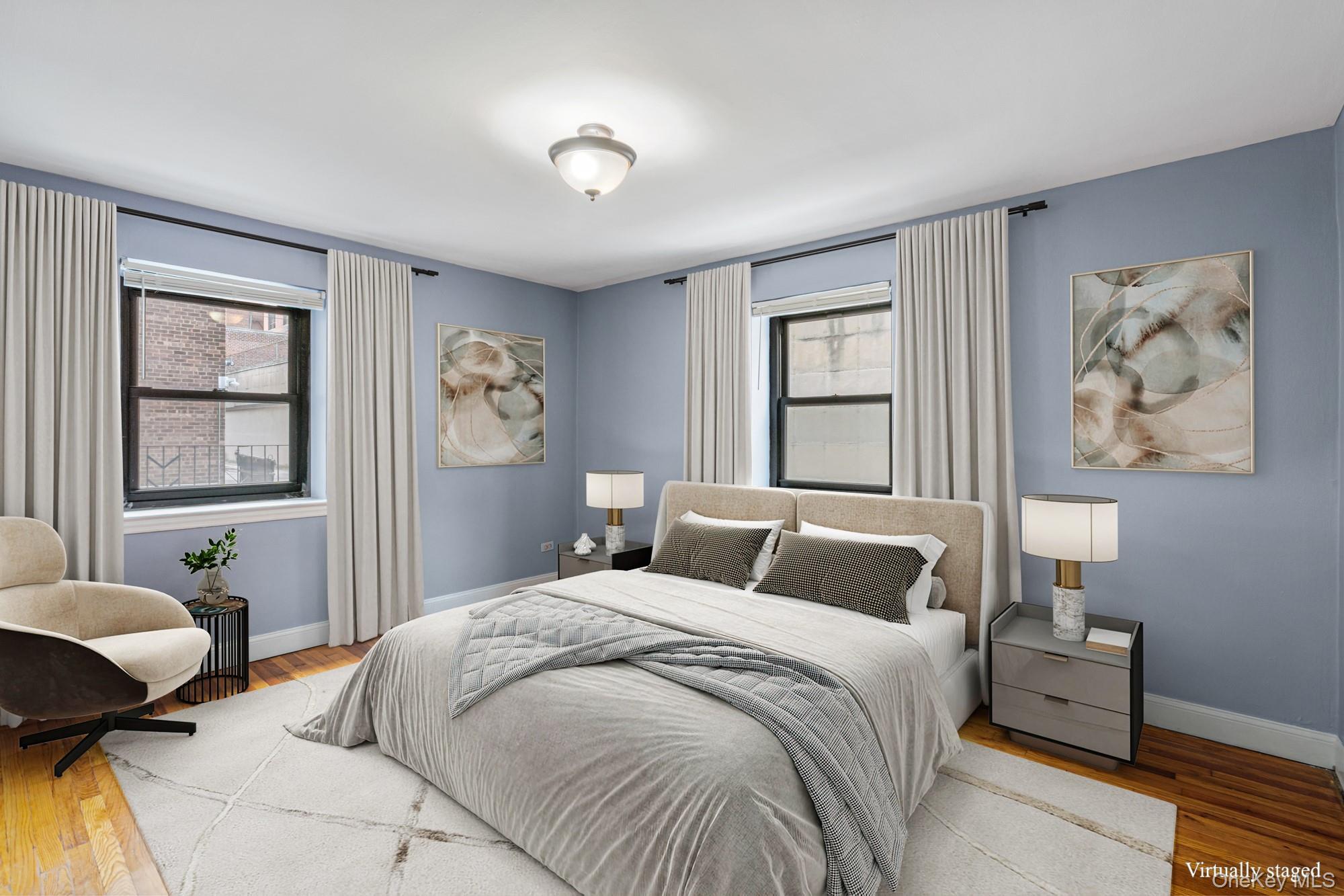 102-55 67th Road, Unit 2V Queens, NY 11375 - Photo 9 of 14 a bedroom with a large bed and a window