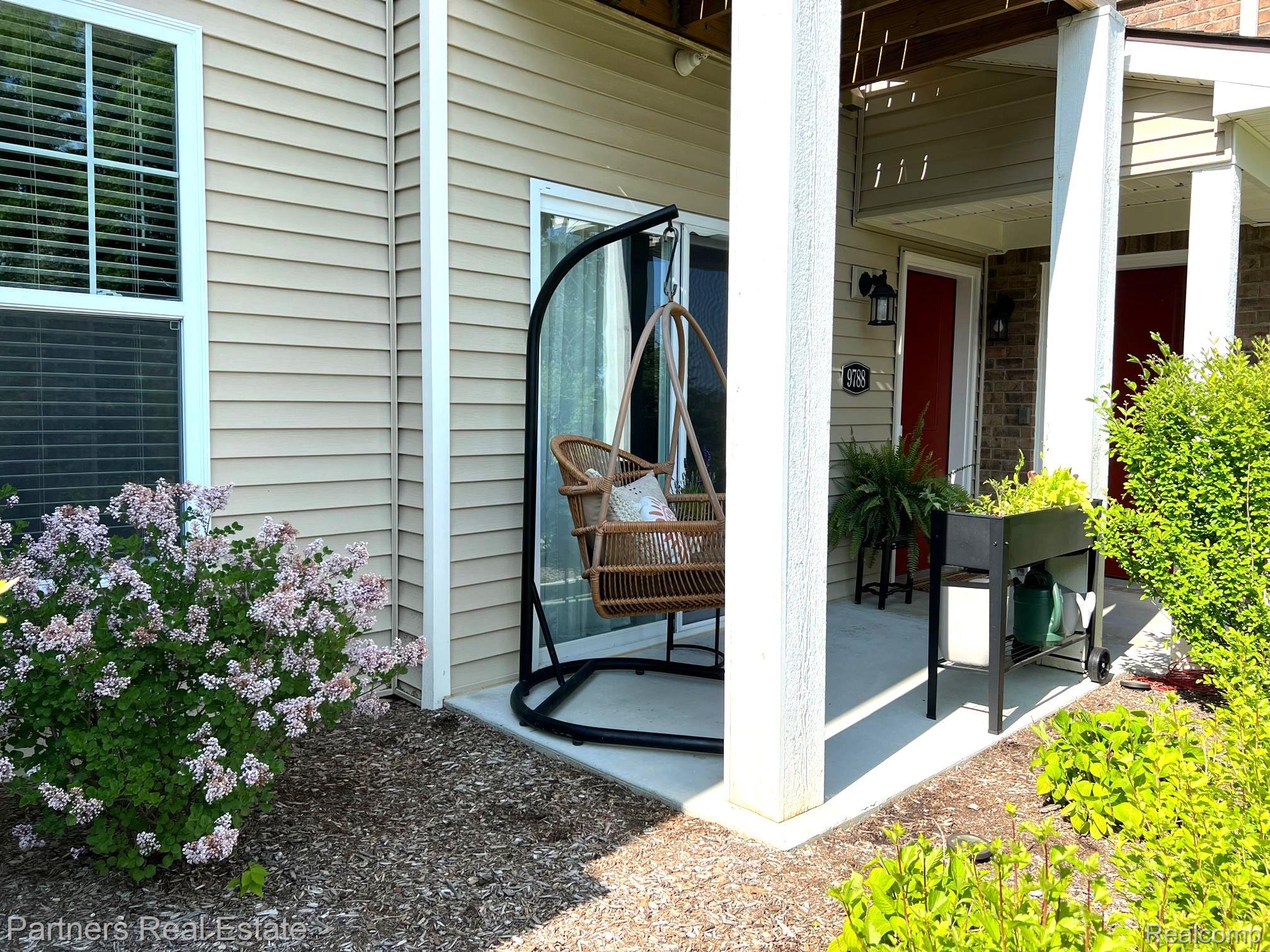 9788 Ridge Run Street, Unit 65 Howell, MI 48855 - Photo 3 of 28 PRIVATE PATIO FACES SOUTH FOR LOTS OF SUNSHINE!