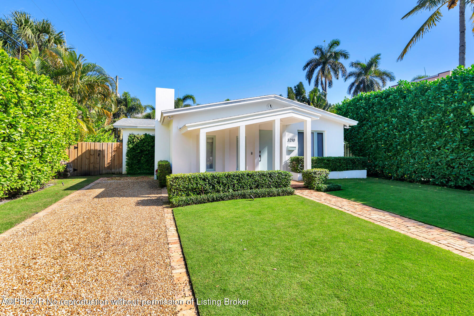 3210 Vincent Road West Palm Beach, FL 33405 - Photo 3 of 20 a front view of a house with a yard