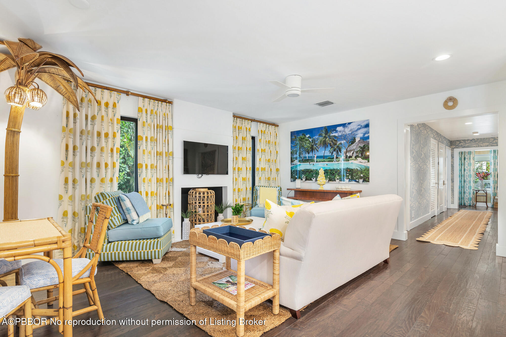 3210 Vincent Road West Palm Beach, FL 33405 - Photo 7 of 20 a living room with fireplace furniture and a floor to ceiling window