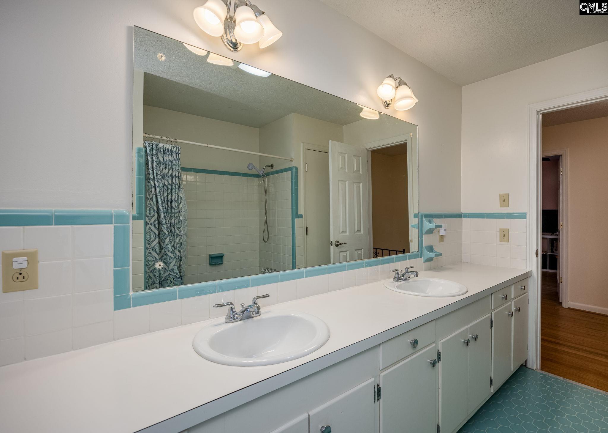 560 Edisto Street Batesburg, SC 29006 - Photo 33 of 49 a bathroom with a sink double vanity and a mirror