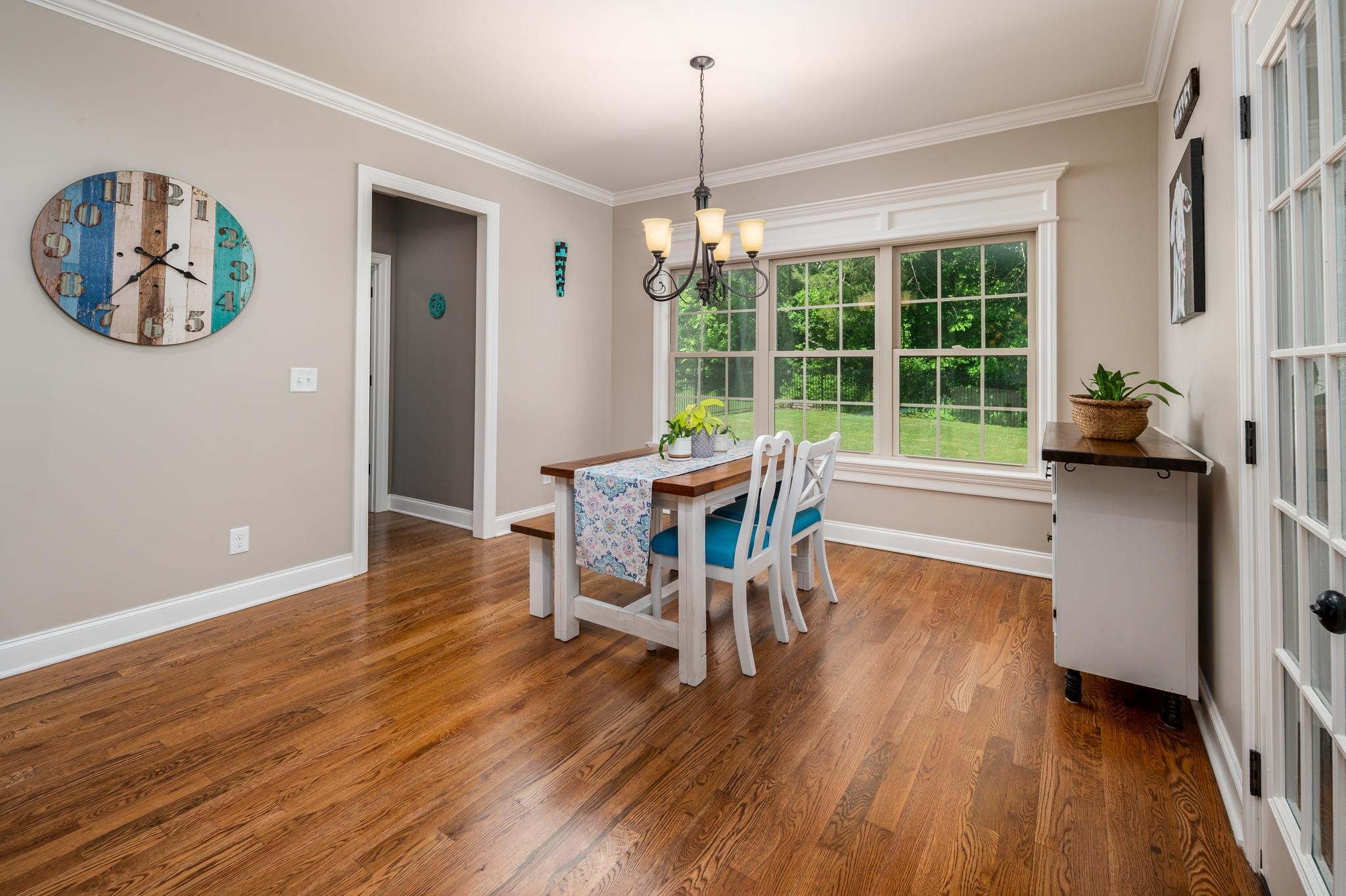 116 Rockingham Drive Murfreesboro, TN 37129 - Photo 13 of 40 a dining room with furniture a chandelier and wooden floor