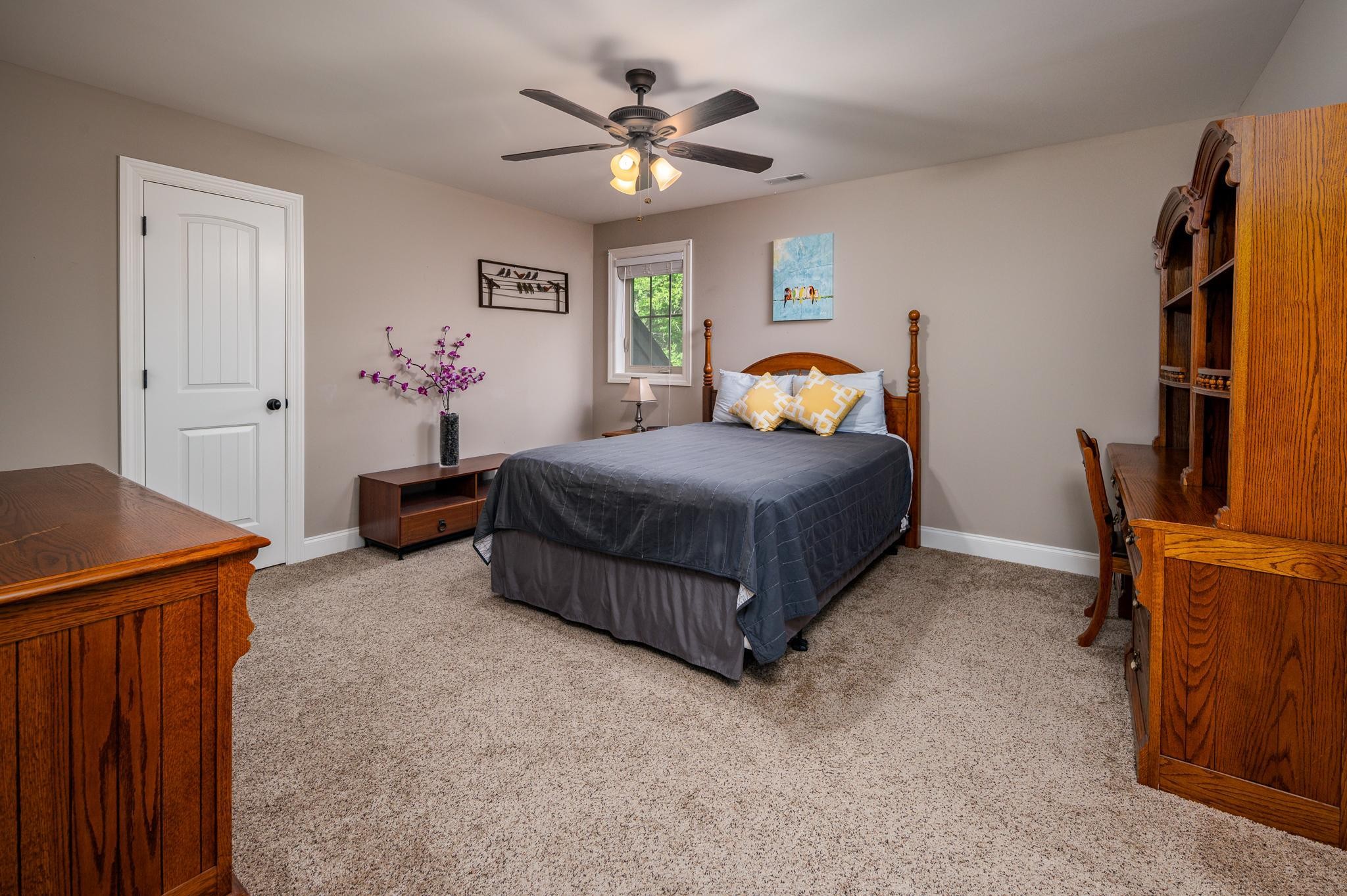 116 Rockingham Drive Murfreesboro, TN 37129 - Photo 24 of 40 a bedroom with a bed and a chandelier