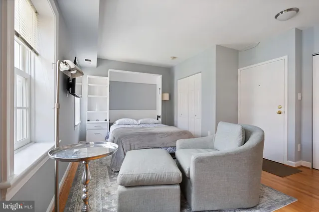 a bathroom with a toilet sink vanity tub and shower