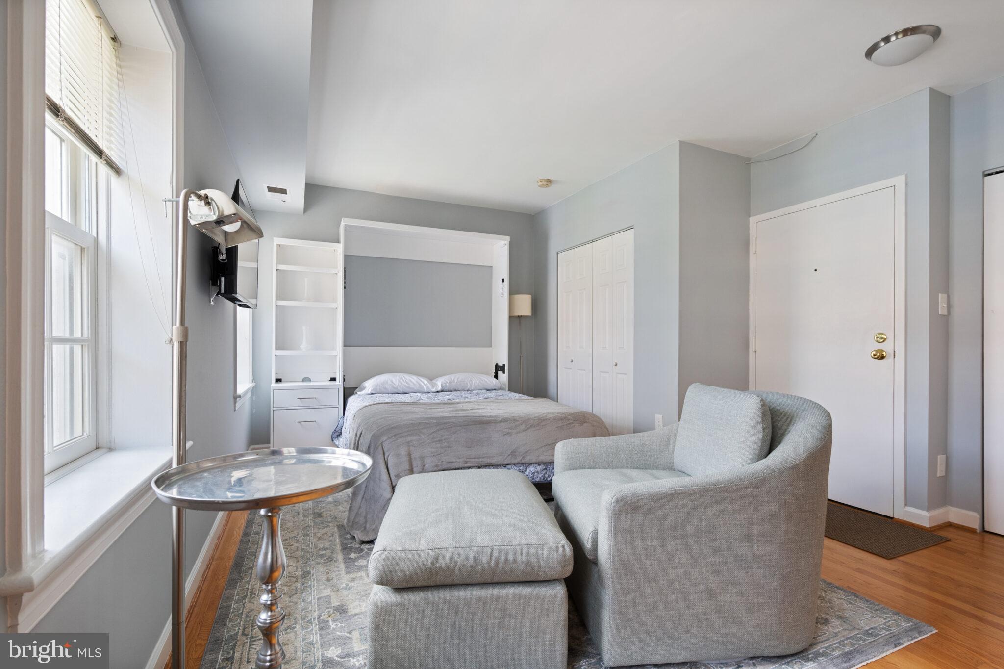 1426 21st Street Northwest, Unit 407 Washington, DC 20036 - Photo 13 of 58 a living room with furniture and a window