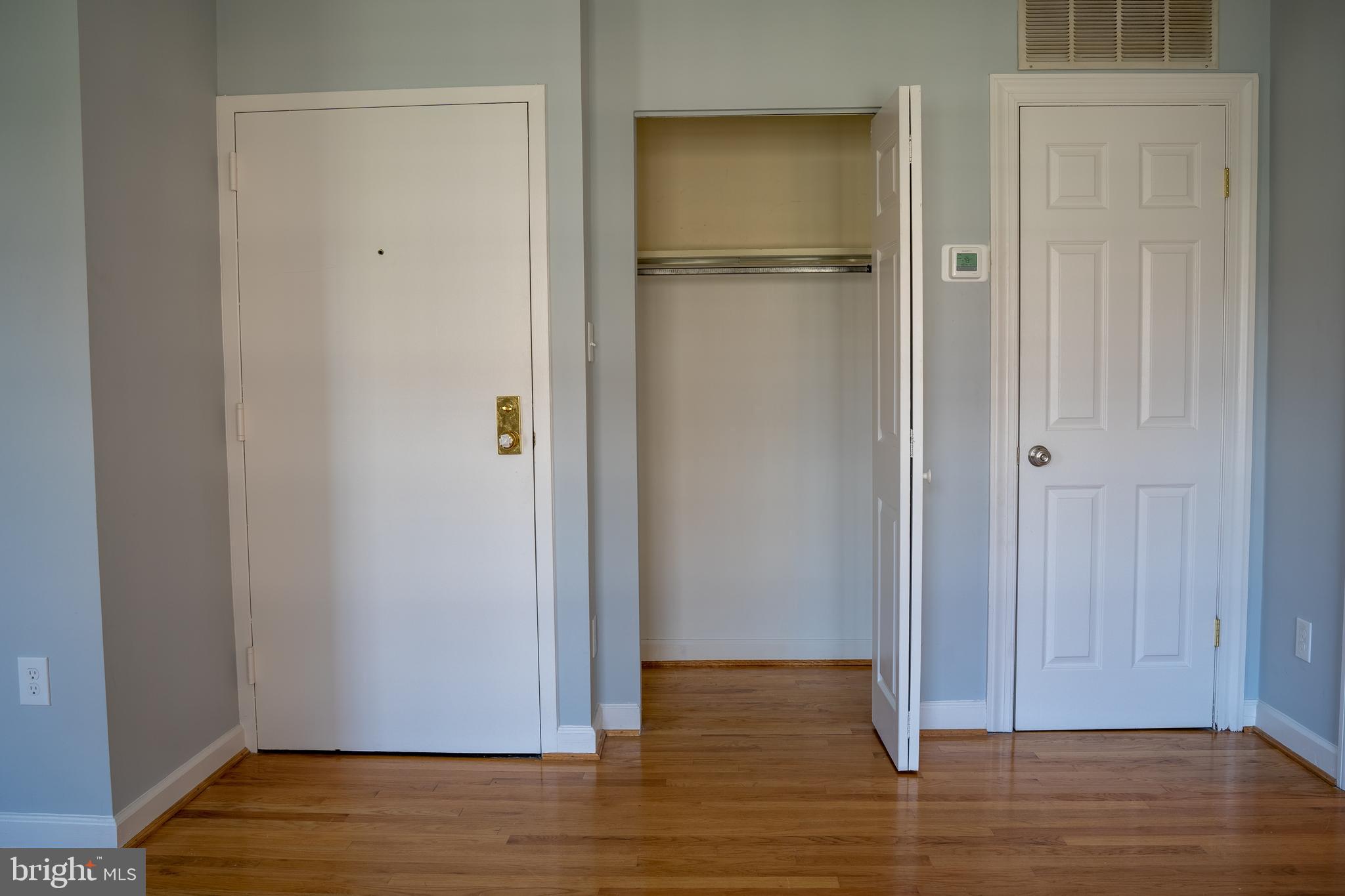 1426 21st Street Northwest, Unit 407 Washington, DC 20036 - Photo 16 of 58 a view of empty room with wooden floor