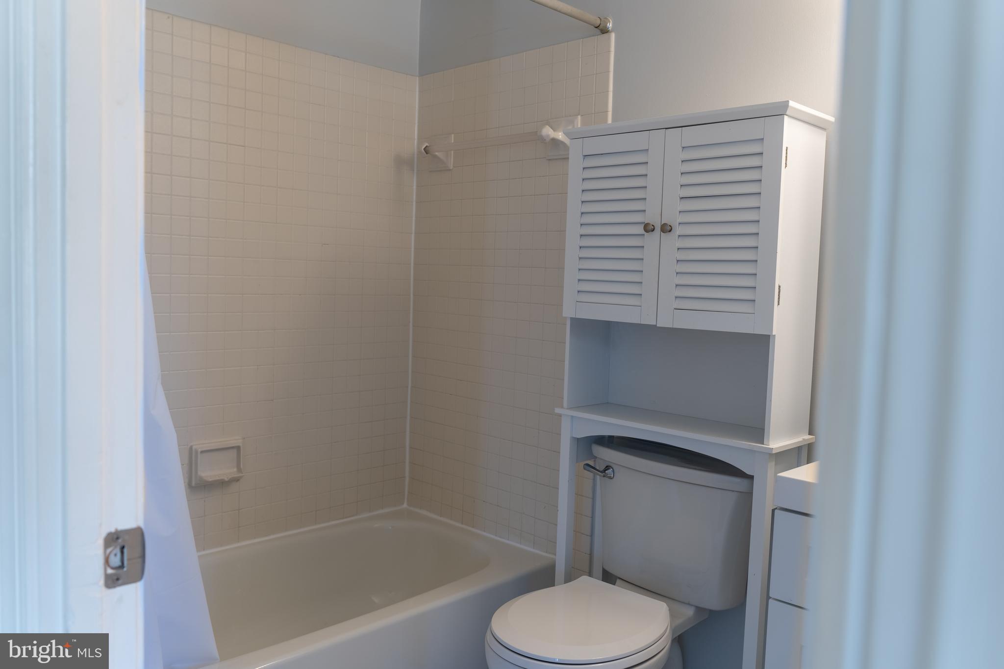 1426 21st Street Northwest, Unit 407 Washington, DC 20036 - Photo 24 of 58 a bathroom with a shower toilet and sink