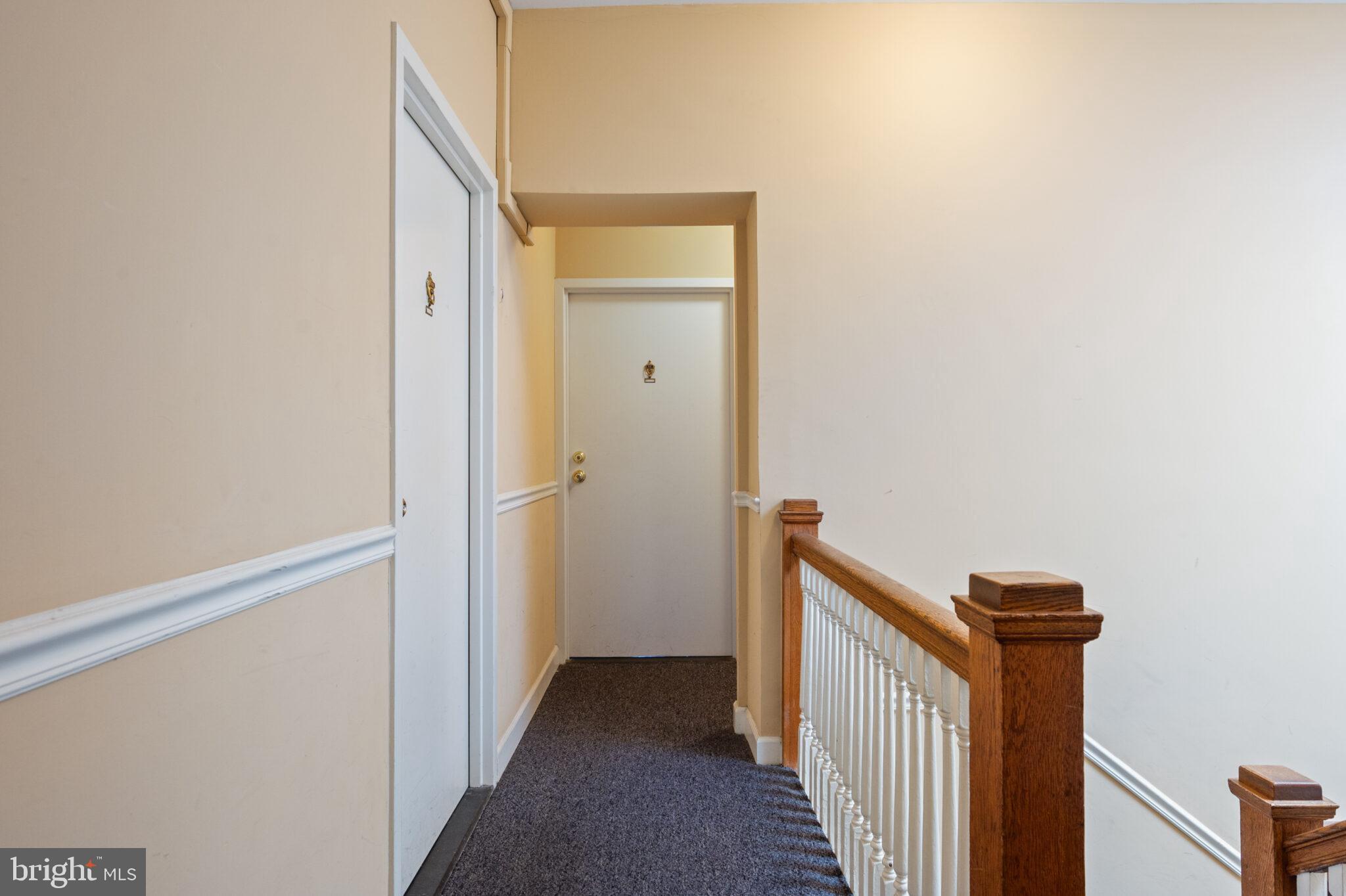 1426 21st Street Northwest, Unit 407 Washington, DC 20036 - Photo 25 of 58 a view of a hallway with wooden floor