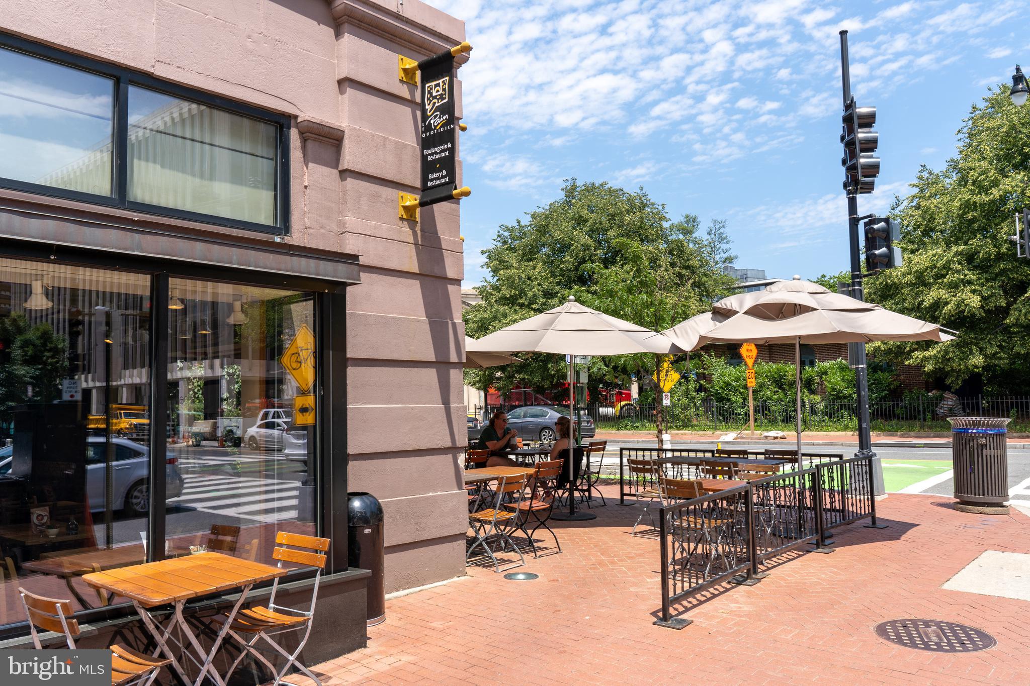 1426 21st Street Northwest, Unit 407 Washington, DC 20036 - Photo 39 of 58 a view of a patio with a table and chairs under an umbrella