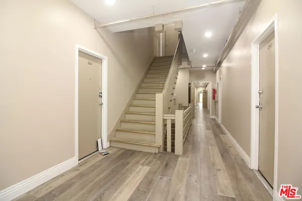 a view of entryway with wooden floor