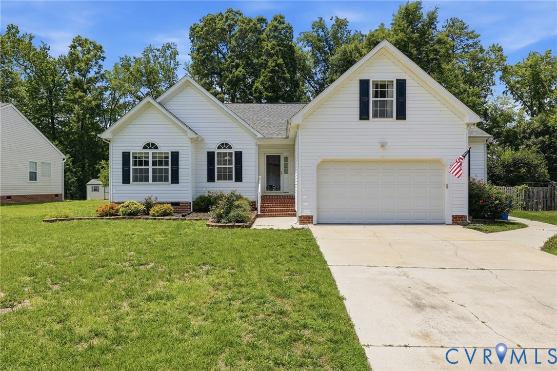 14719 Clover Ridge Lane Chesterfield, VA 23832 - Photo 2 of 36 White siding exterior with a prominent two-car gar