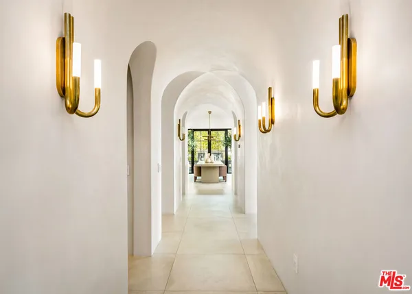 a view of a living space with a swimming pool