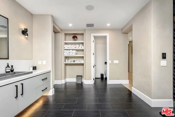 a view of kitchen with stainless steel appliances a refrigerator and a sink