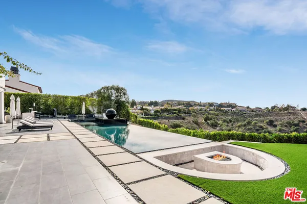 a view of swimming pool with seating space