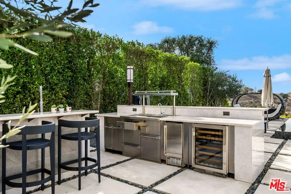 a view of a kitchen outdoor space and sitting area