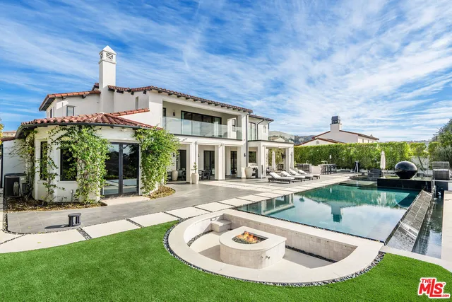 a swimming pool with outdoor seating yard and barbeque oven