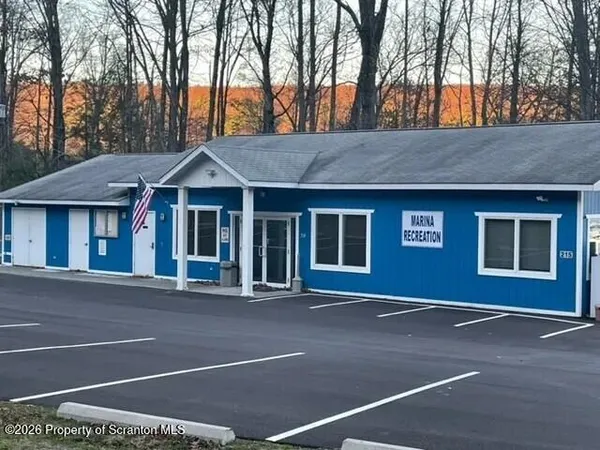 a front view of a house with a garage