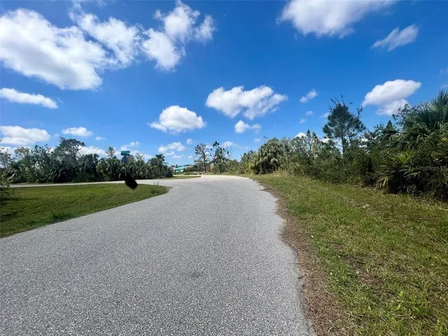 a view of a lake with a yard