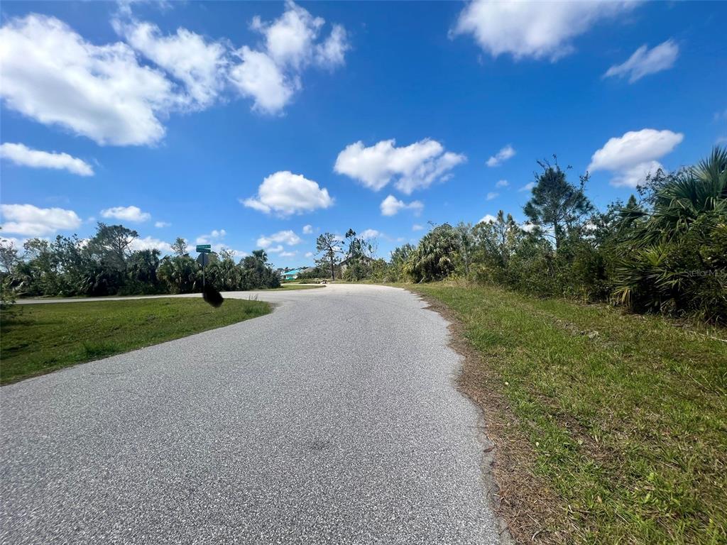 5252 Anderson Road Port Charlotte, FL 33981 - Photo 3 of 5 a view of a lake with a yard