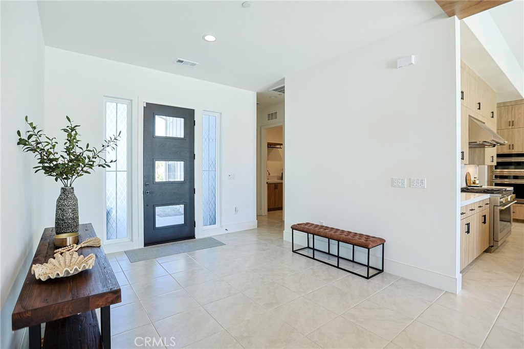 32213 Daybrook Terrace Temecula, CA 92591 - Photo 29 of 75 a living room with furniture and a potted plant
