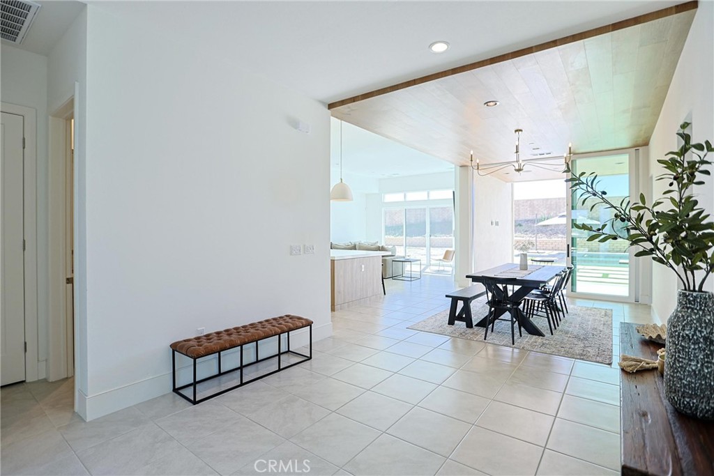 32213 Daybrook Terrace Temecula, CA 92591 - Photo 31 of 75 a dining room with furniture and a potted plant