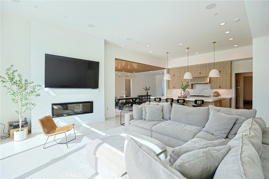 32213 Daybrook Terrace Temecula, CA 92591 - Photo 33 of 75 a living room with furniture a fireplace and a flat screen tv