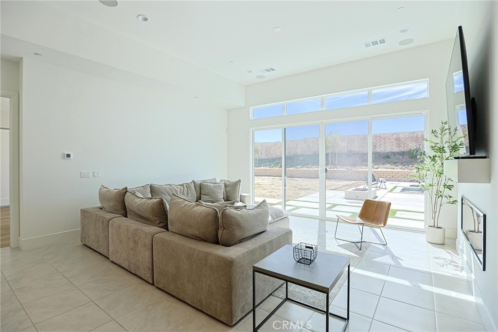 32213 Daybrook Terrace Temecula, CA 92591 - Photo 35 of 75 a living room with furniture and a flat screen tv