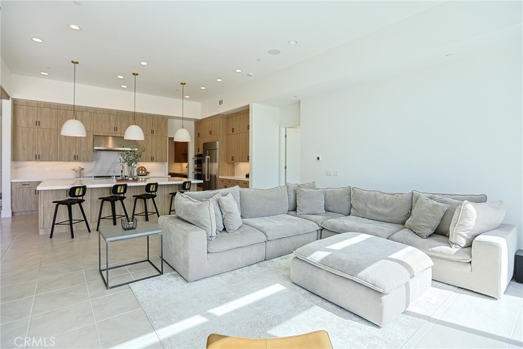 32213 Daybrook Terrace Temecula, CA 92591 - Photo 40 of 75 a living room with furniture kitchen view and a chandelier