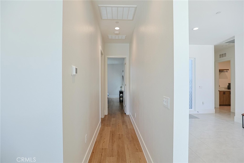 32213 Daybrook Terrace Temecula, CA 92591 - Photo 42 of 75 a view of a hallway with wooden floor and a bathroom